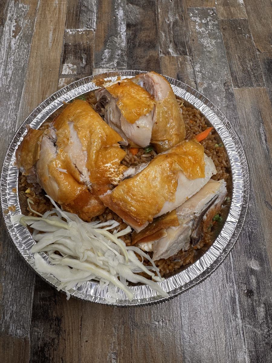 Golden roast chicken over fried rice with cabbage